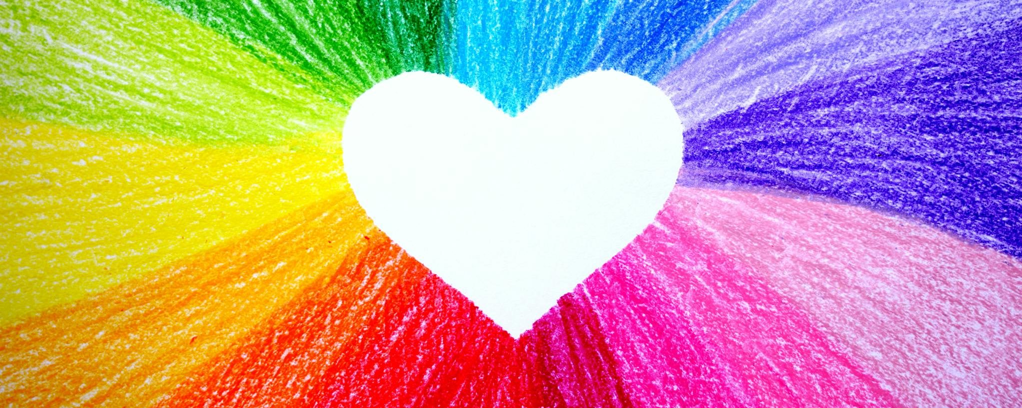 Colorful crayon heart design with rainbow hues radiating vibrantly. A perfect blend of artistic expression and vivid color.